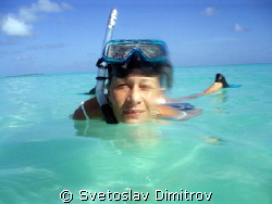 My wife has just finised her snorkeling by Svetoslav Dimitrov 